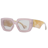Oversized square frame sunglasses in marble acetate material showing textured detail and bold design