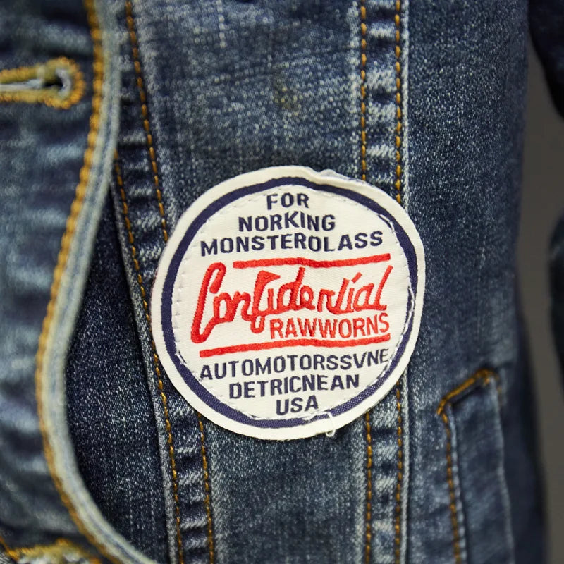 Men's blue stretch denim jacket with badge patches and ripped patchwork streetwear design detail