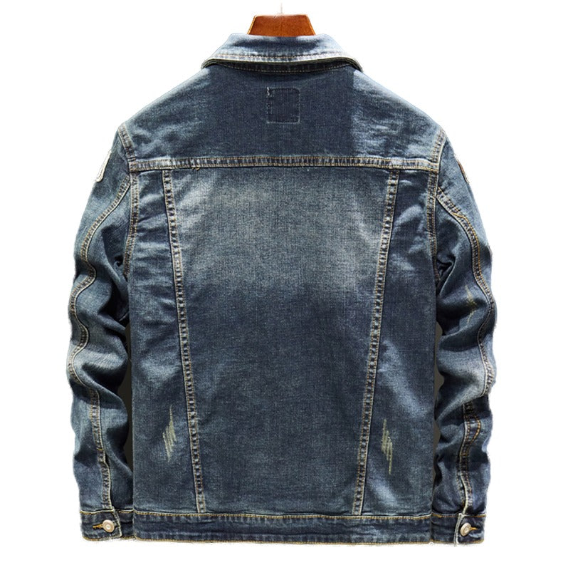 Men's blue stretch denim jacket with badge patches and ripped patchwork streetwear design detail