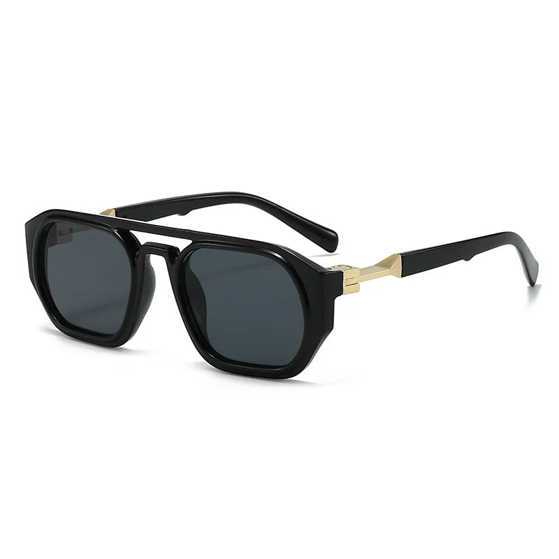 Clear frame sunglasses with pink tinted lens and orange acetate arm detail closeup