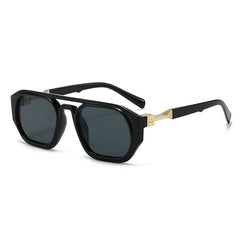 Clear frame sunglasses with pink tinted lens and orange acetate arm detail closeup