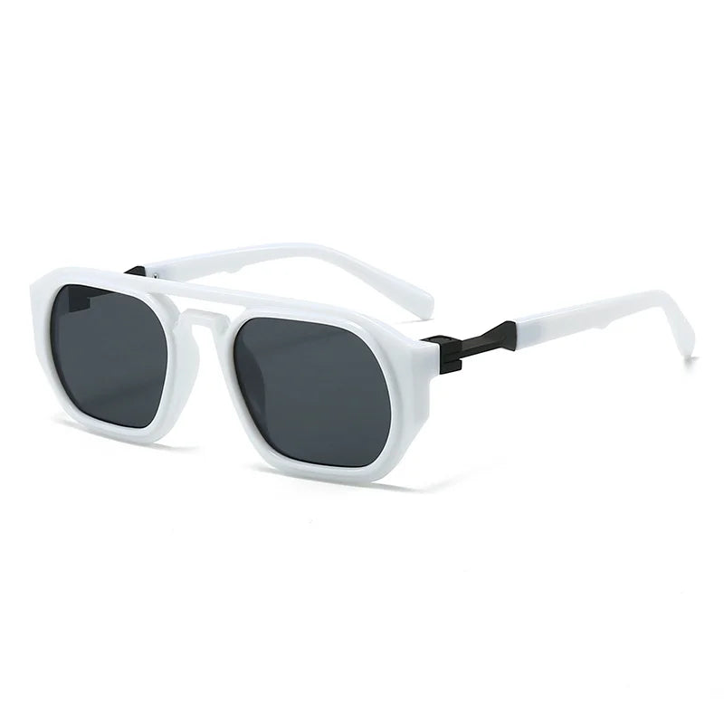 Clear frame sunglasses with pink tinted lens and orange acetate arm detail closeup