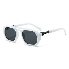 Clear frame sunglasses with pink tinted lens and orange acetate arm detail closeup