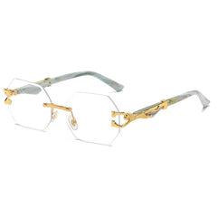 Gold metal hexagon rimless sunglasses with blue gradient lens and decorative temple detail close-up