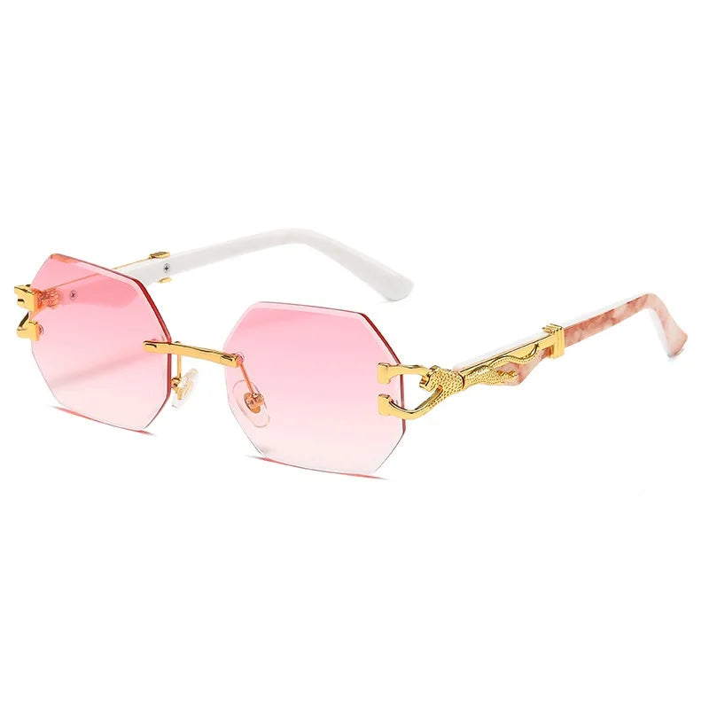 Gold metal rimless sunglasses with blue gradient lenses and decorative temple detail close-up