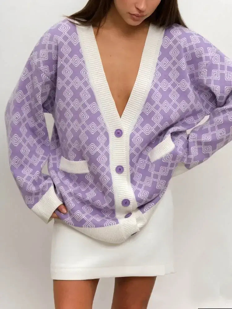 Model wearing a Knitted Oversized V Neck Long Sleeve Cardigan in purple with white patterns