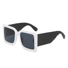 Mint vegan leather arms detail on oversized square sunglasses with bold color block design