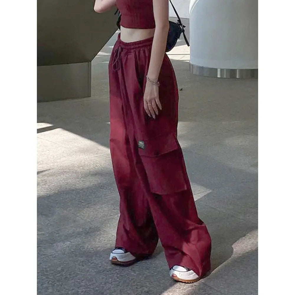 Oversize red cargo pants with multiple pockets