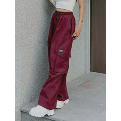 Oversize red cargo pants with multiple pockets