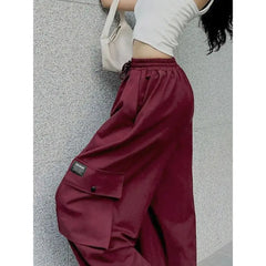 Oversize red cargo pants with multiple pockets