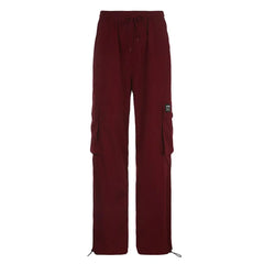 Oversize red cargo pants with multiple pockets