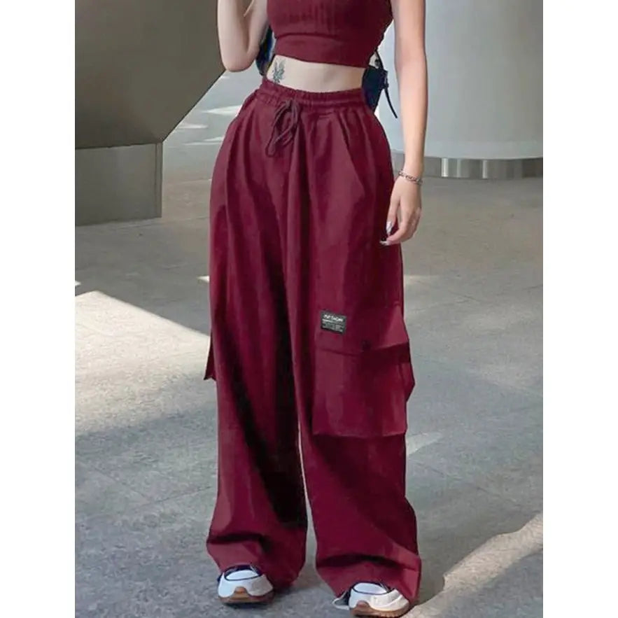 Oversize red cargo pants with multiple pockets