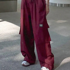 Oversize red cargo pants with multiple pockets