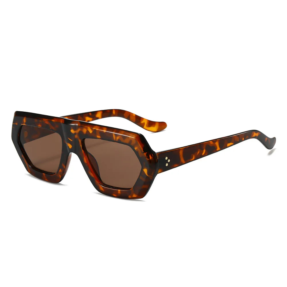 Oversized color block sunglasses with amber tortoiseshell chunky frame and gradient lens detail.