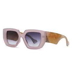 Oversized square frame sunglasses in marble acetate showing textured material detail and bold design