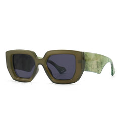 Oversized square frame sunglasses in marble acetate showing textured material detail and bold design.