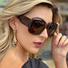 Oversized square frame sunglasses with gradient lens detail showcasing colorful cyber eyewear design