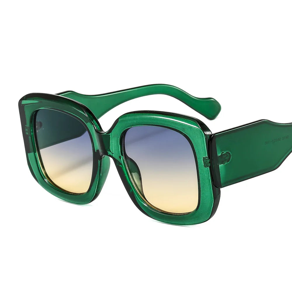 Oversized square frame sunglasses with gradient lens detail showcasing colorful eyewear material and texture