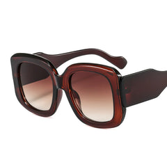 Oversized square frame sunglasses with gradient lens detail showcasing material texture and color transition