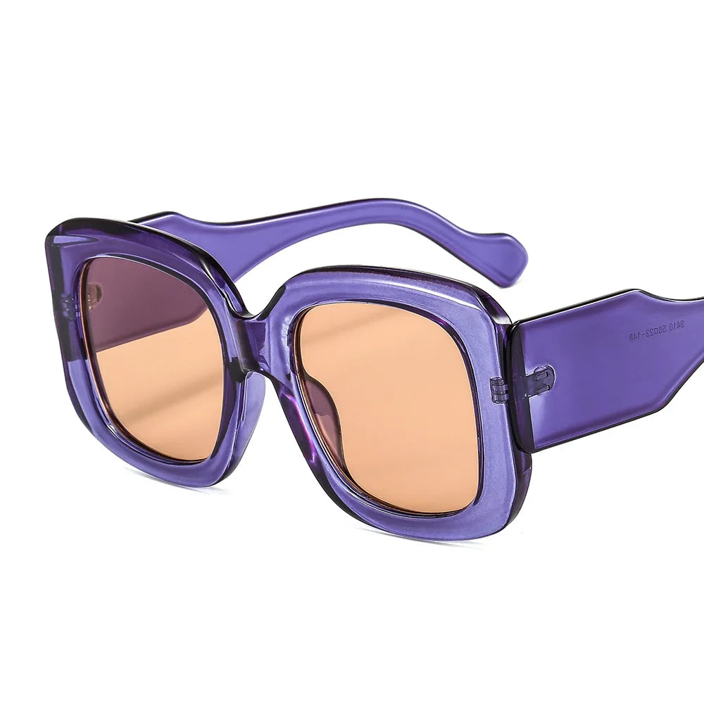 Oversized square frame sunglasses with gradient lens detail showcasing material texture and color transition