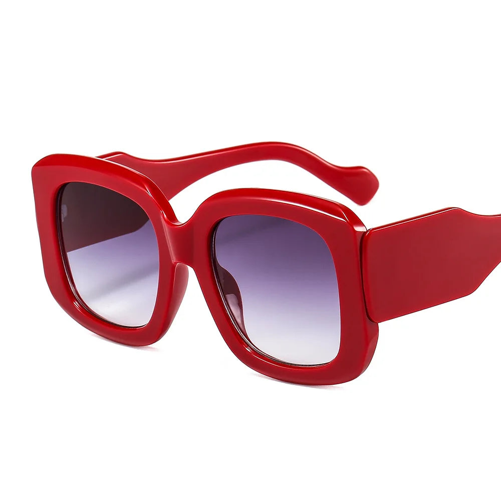 Oversized square frame sunglasses with gradient lens detail showcasing material texture and cyber style