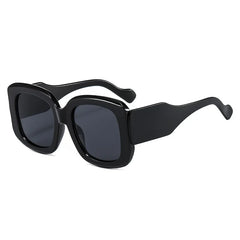 Oversized square frame sunglasses with gradient lens detail showing material texture and color transition