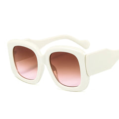 Oversized square frame sunglasses with gradient lens displayed at side angle showcasing material texture and design details