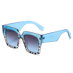 Oversized square sunglasses with blue tortoiseshell gradient lens detail and bold frame design