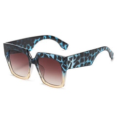 Oversized square sunglasses with blue tortoiseshell pattern and gradient lens in bold frame design