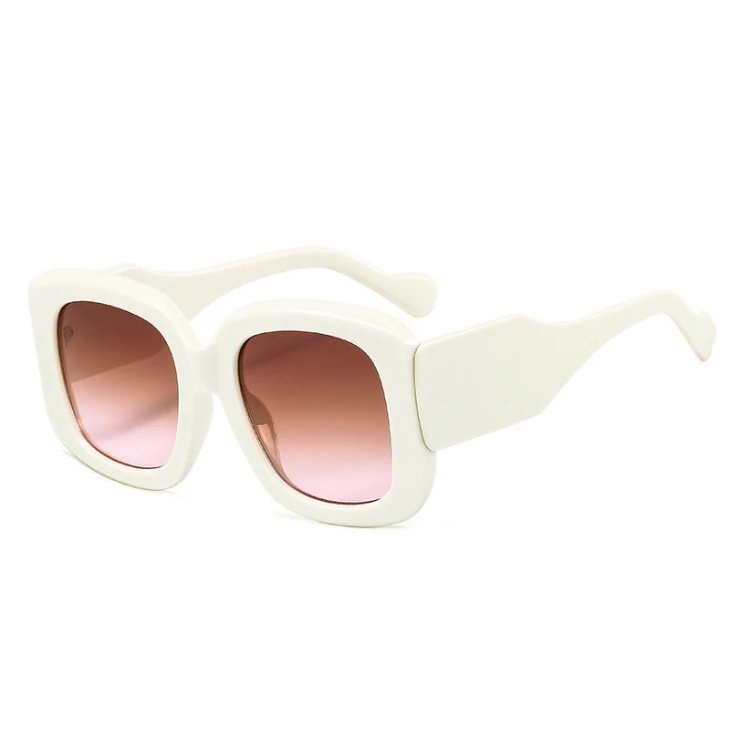 Oversized square sunglasses with chunky resin frame showcasing gradient colorway and UV protection detail.