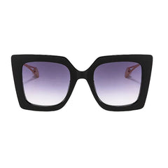 Oversized square sunglasses with gradient lens and gold acetate arm detail close-up