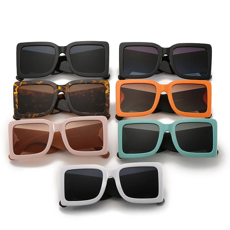 Oversized square sunglasses with mint vegan leather arms and bold color block design detail