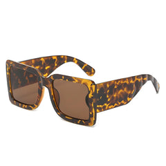 Oversized square sunglasses with vegan leather mint arms detail and bold color block design