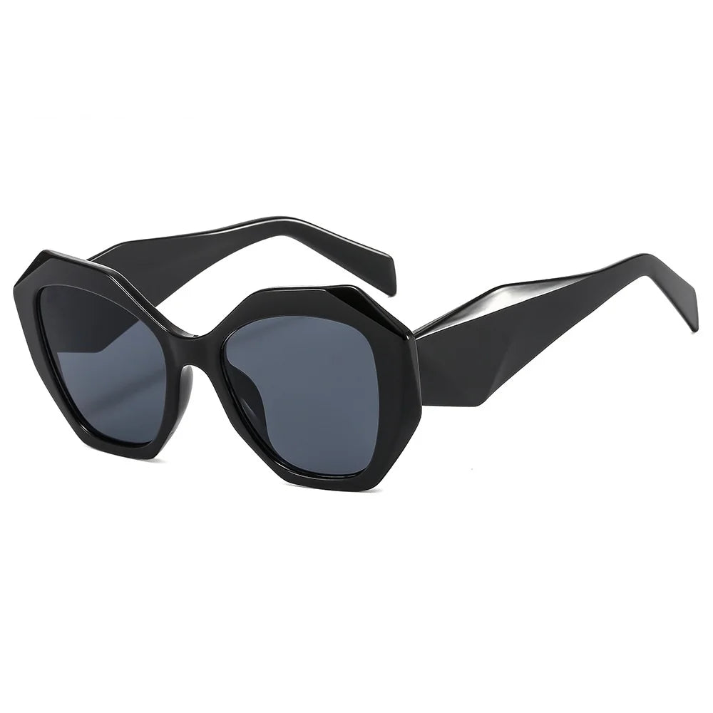 Oversized tortoiseshell hexagon sunglasses with green gradient lens detail and bold frame styling