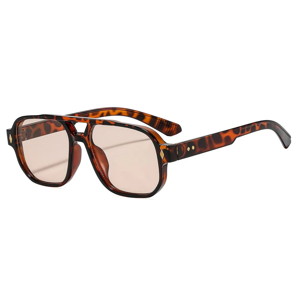 Retro aviator sunglasses with tortoiseshell acetate frame and blue lens detail close up