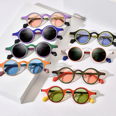 Retro round frame sunglasses with colorful lens and bold eyewear design
