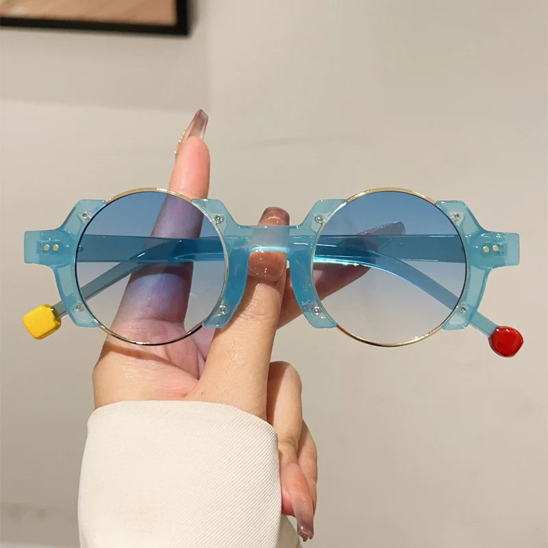 Round frame sunglasses with colorful bubble detail and blue tinted lenses for casual wear
