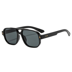 Tortoiseshell acetate frame detail of retro aviator sunglasses with blue lens material closeup