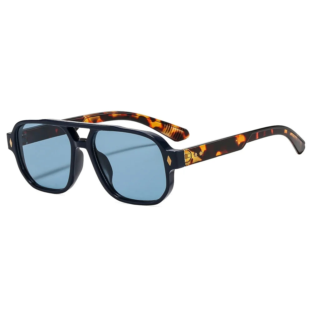 Tortoiseshell acetate frame detail on retro aviator sunglasses with blue lens coating