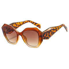 Tortoiseshell green gradient lens detail on oversized hexagon sunglasses bold frame