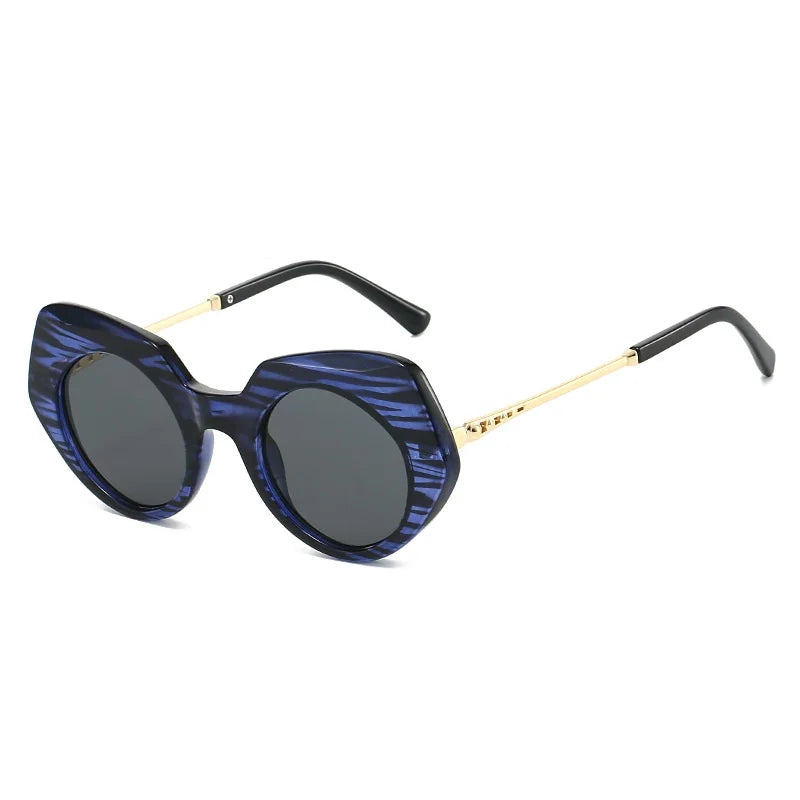 Tortoiseshell oversized round frame sunglasses displaying chunky bold frame design and material texture detail.