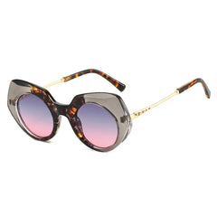 Tortoiseshell oversized round frame sunglasses showcasing chunky acetate material and alternative fashion styling detail.
