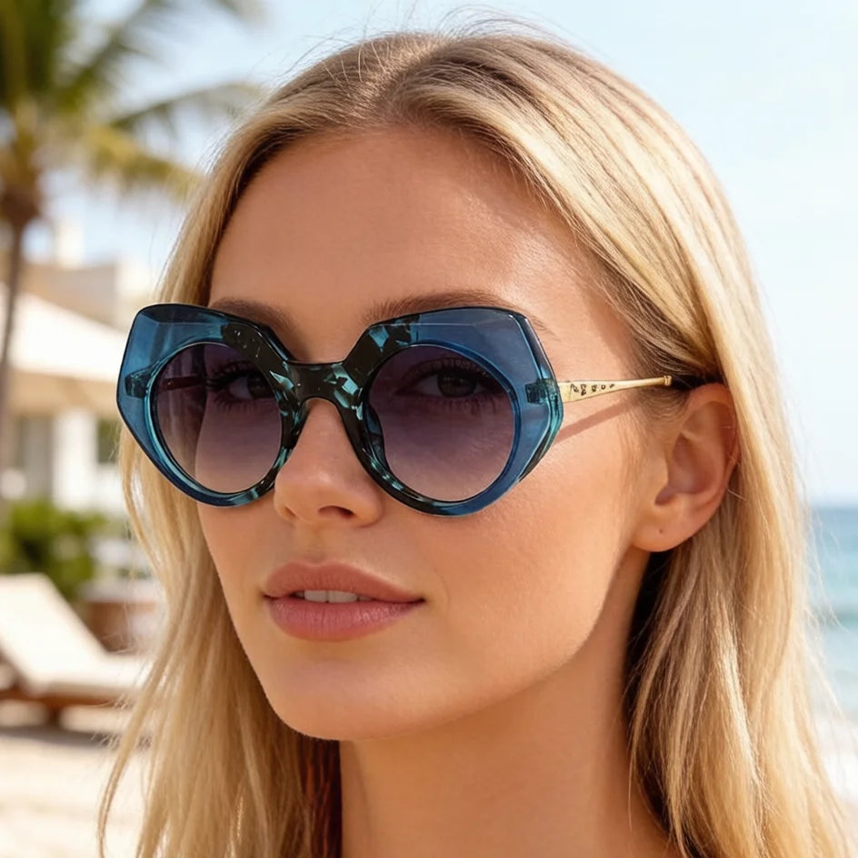 Tortoiseshell oversized round frame sunglasses showing chunky acetate material and bold design details